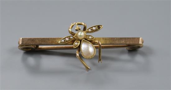 A late Victorian yellow metal and seed pearl set bug bar brooch, 4cm.